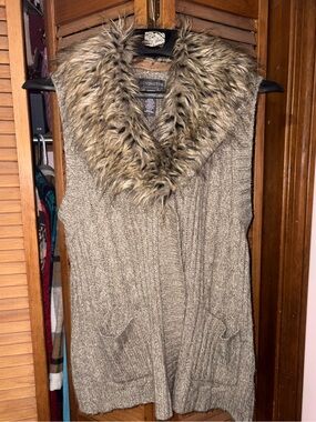 Covington faux fur sleeveless sweater.